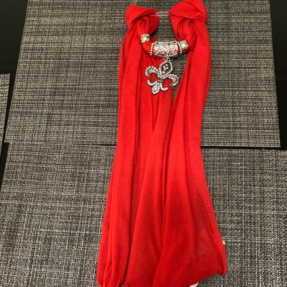 New with tags red scarf with metal arrangement